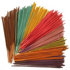 A picture of different coloured incense sticks.