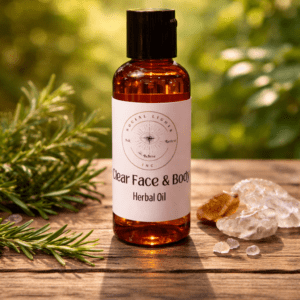 A picture of Clear Face and Body Oil in a flip top container.