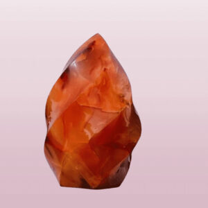 A picture of a carnelian crystal gemstone flame-shaped.